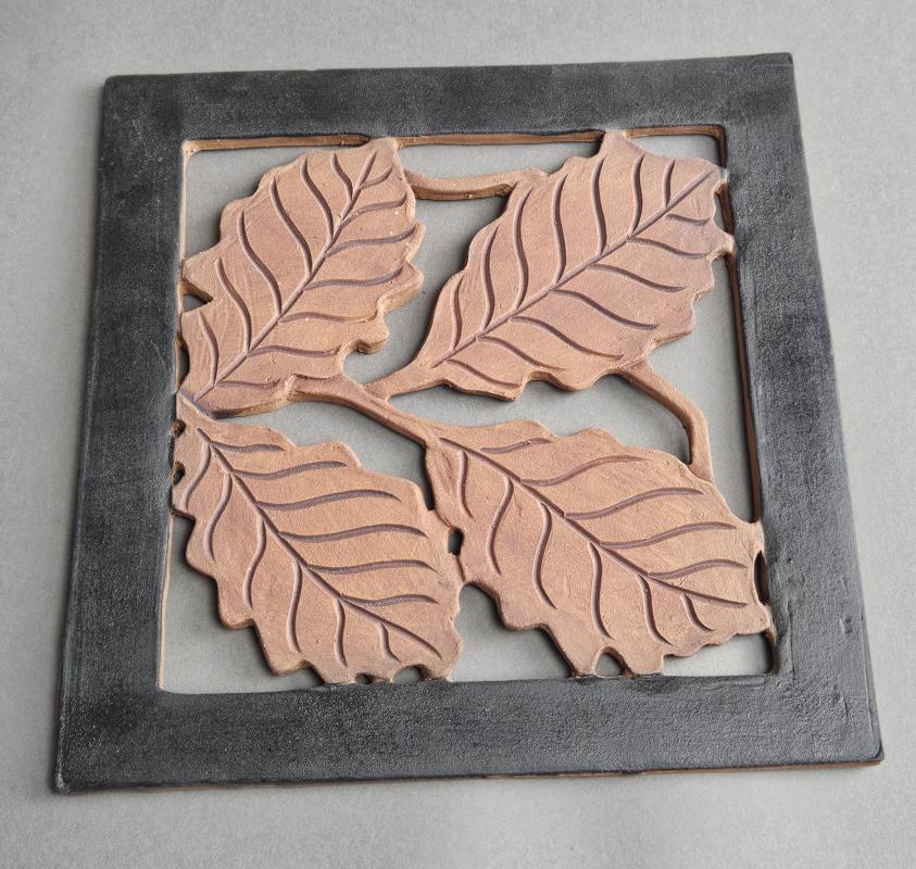 Wall tile with oak leaves